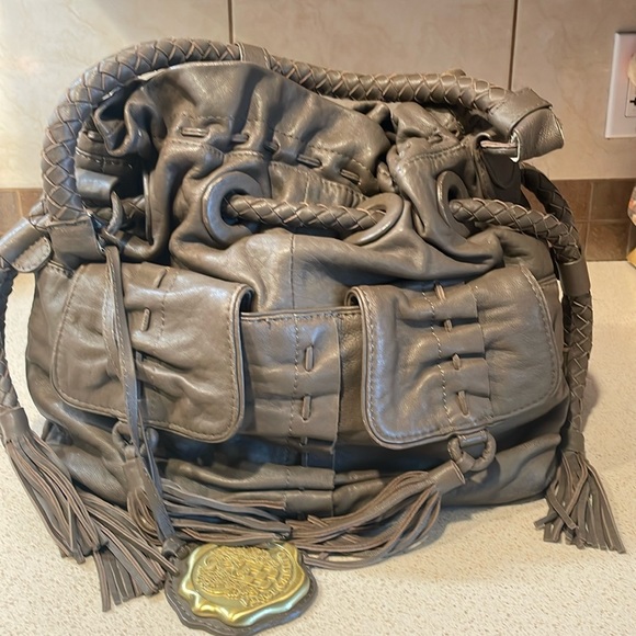 Vince Camuto Handbags - Vince Camuto Grayish Brown Braided Tassel Drawstring Bucket Bag